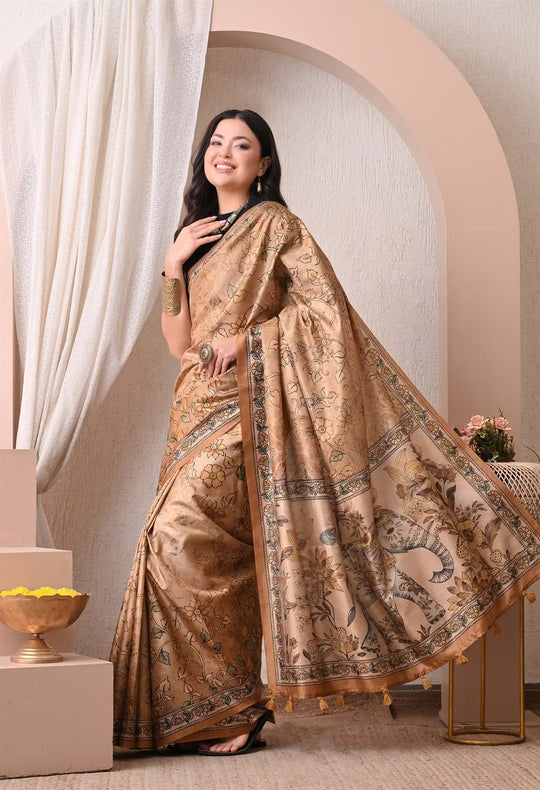 Woman wearing a Yellow Elephant Pallu Kalamkari print saree.