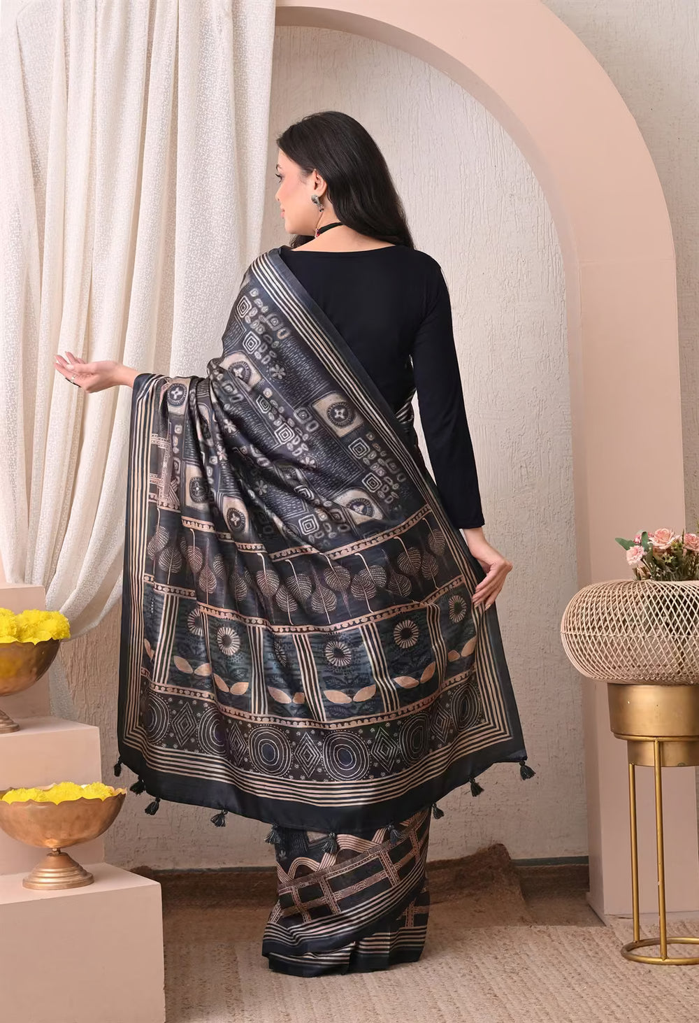 Woman in Batik Print in Navy Blue saree.