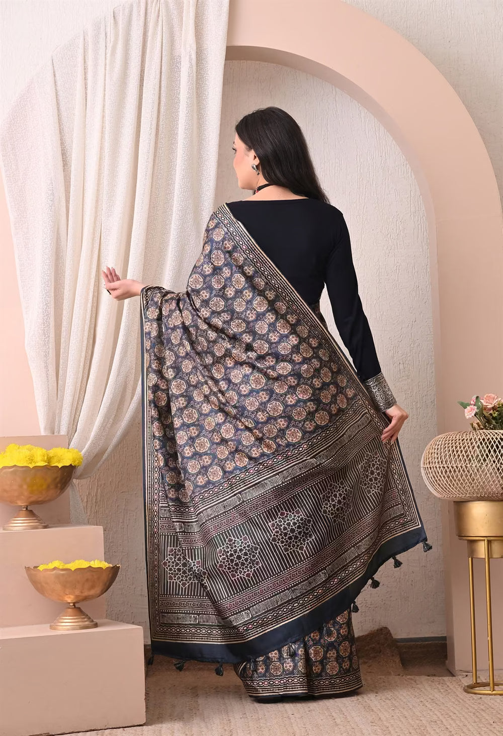 Woman in Floral medallion motifs arranged in a classic Ajrakh pattern saree.