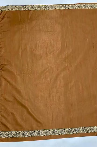 Plain Brown tone saree blouse with Ikkat print border.