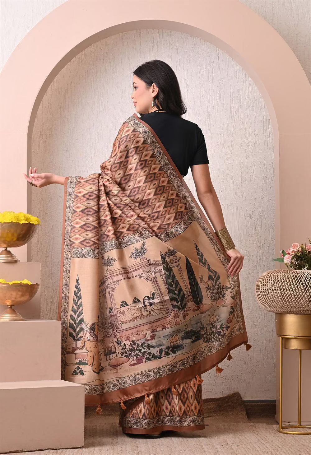 Woman in Brown Ikkat Pattern with Kalamkari pallu saree.