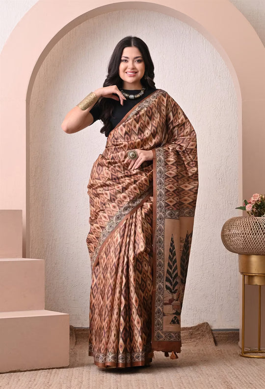 Woman wearing a Brown Ikkat Pattern with Kalamkari pallu saree.