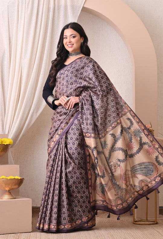 Woman wearing a Ikkat Pattern in Purple & Cream colour with Kalamkari pallu saree.