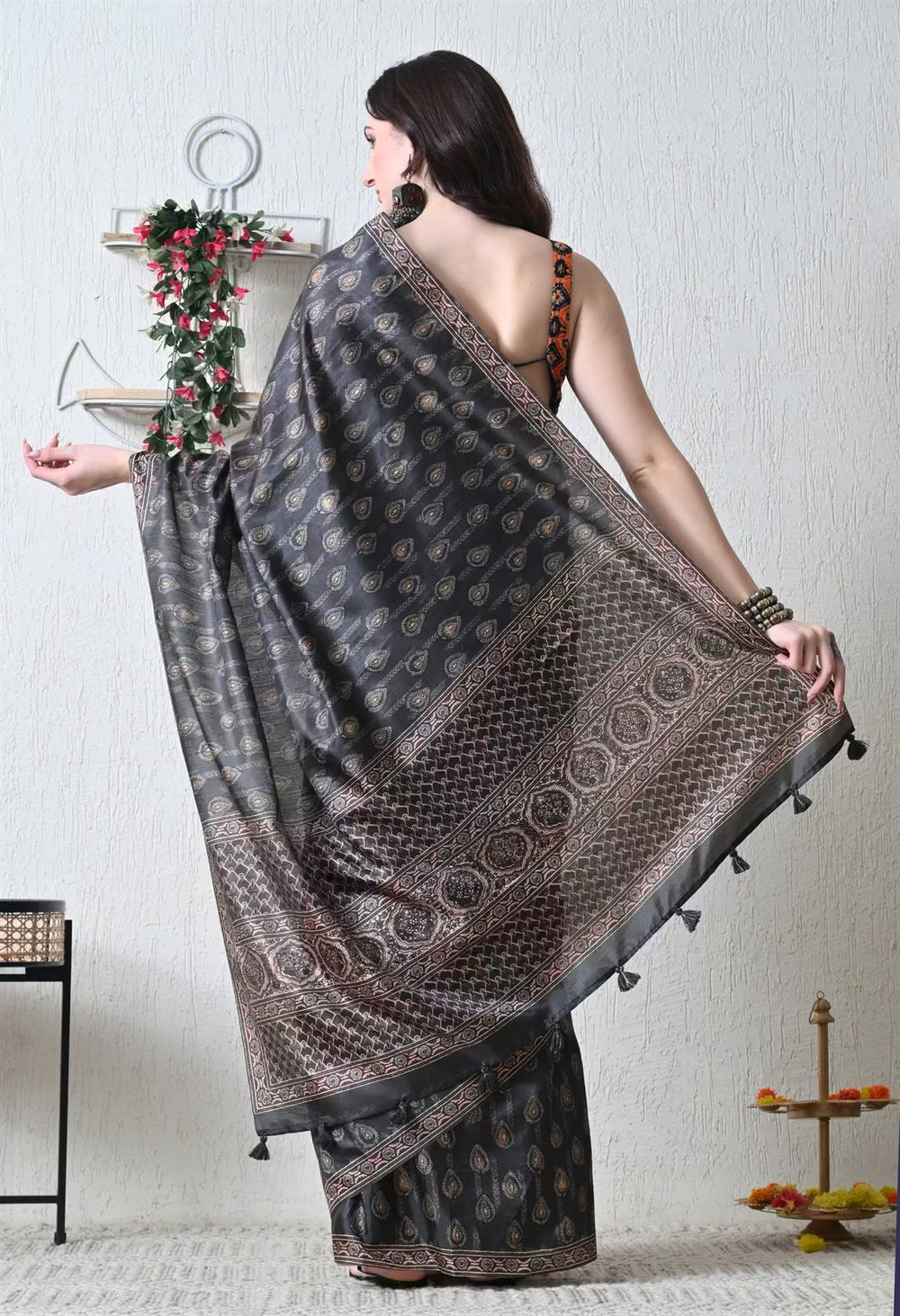 Woman in Black Ajrakh Butti Pattern With Pallu Border.