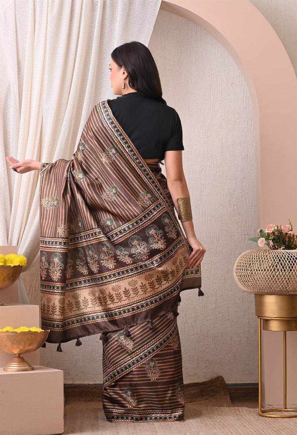Woman in Ajrakh Butta With Stripe pattern in Brown colour saree.