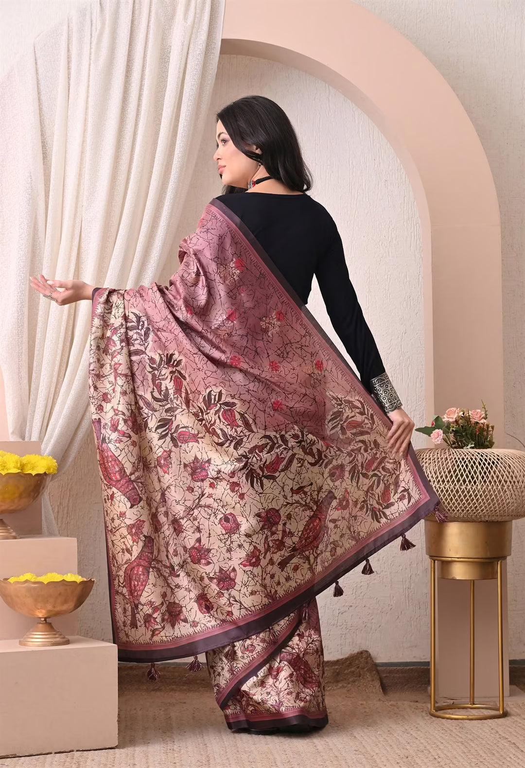 Woman in Beautifully detailed Bird and Floral print saree.