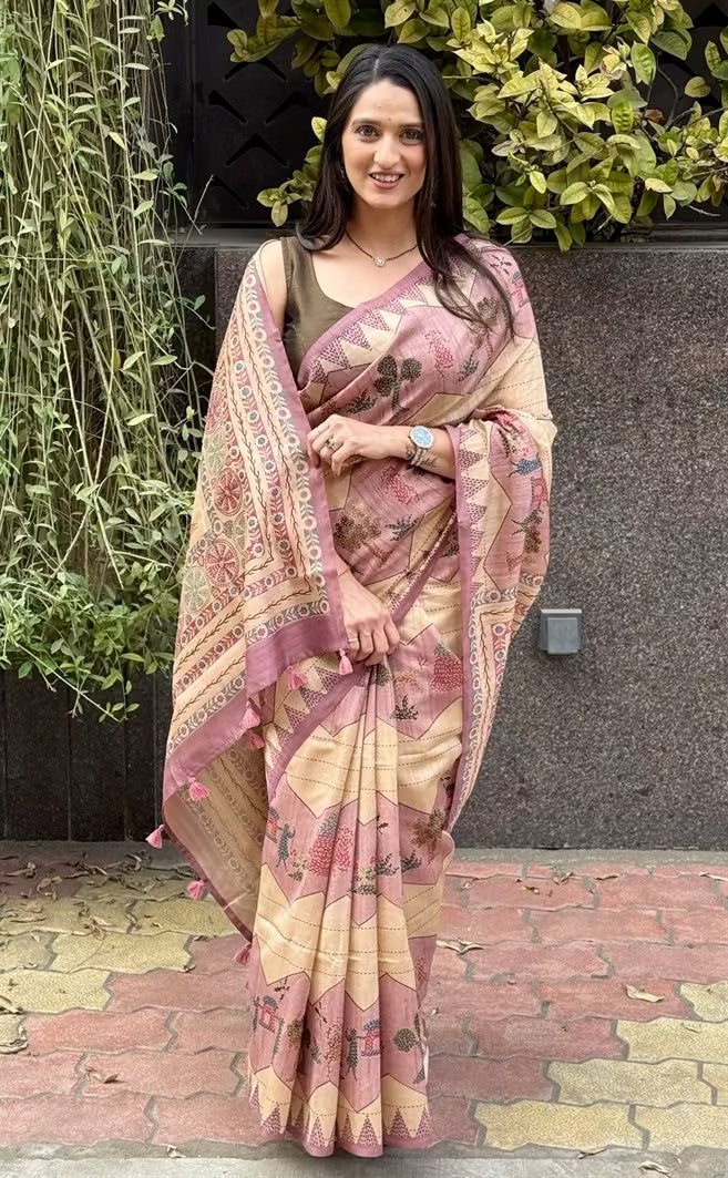 Woman wearing a Lehariya print in Pink & Beige base saree.