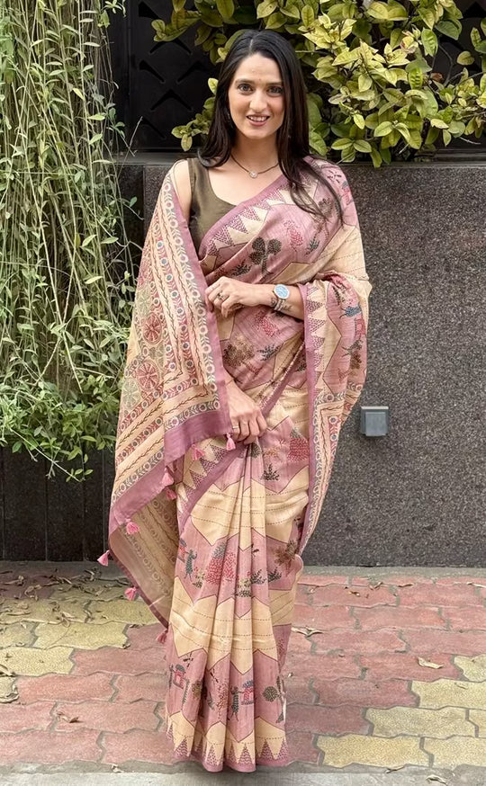 Woman wearing a Lehariya print in Pink & Beige base saree.