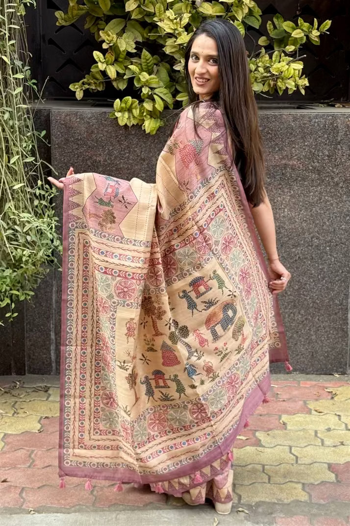 Woman in Lehariya print with Pink & Beige base saree.