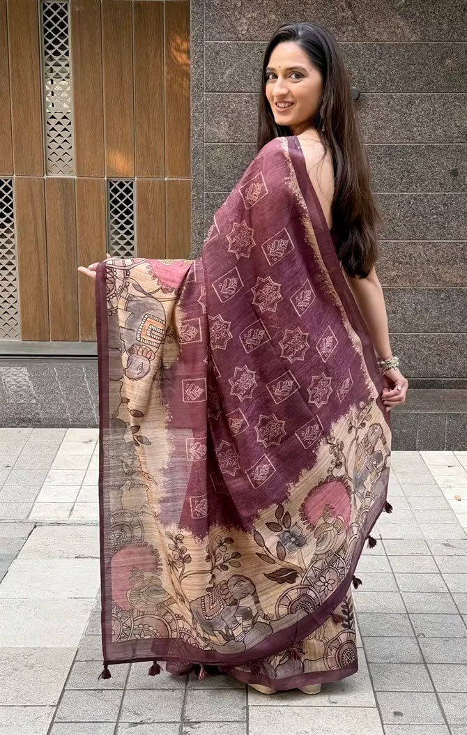 Woman in Rich Wine with Beige Kalamkari printed pallu saree.