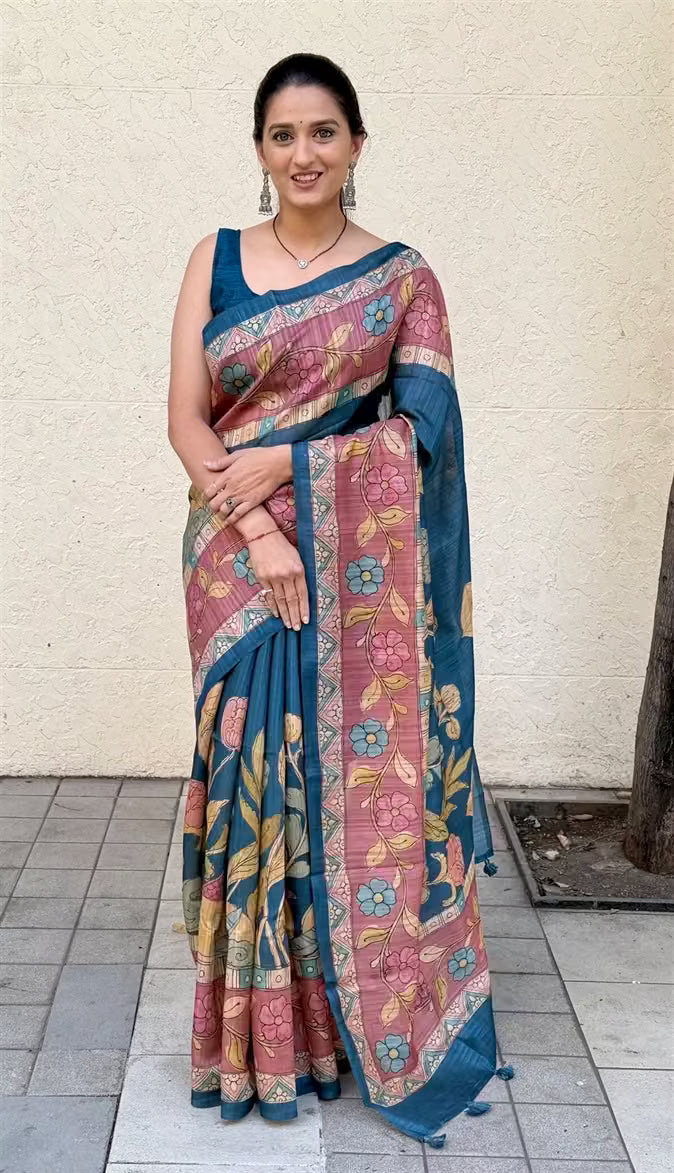 Woman wearing a Blue Big Floral Print Soft Silk Saree.