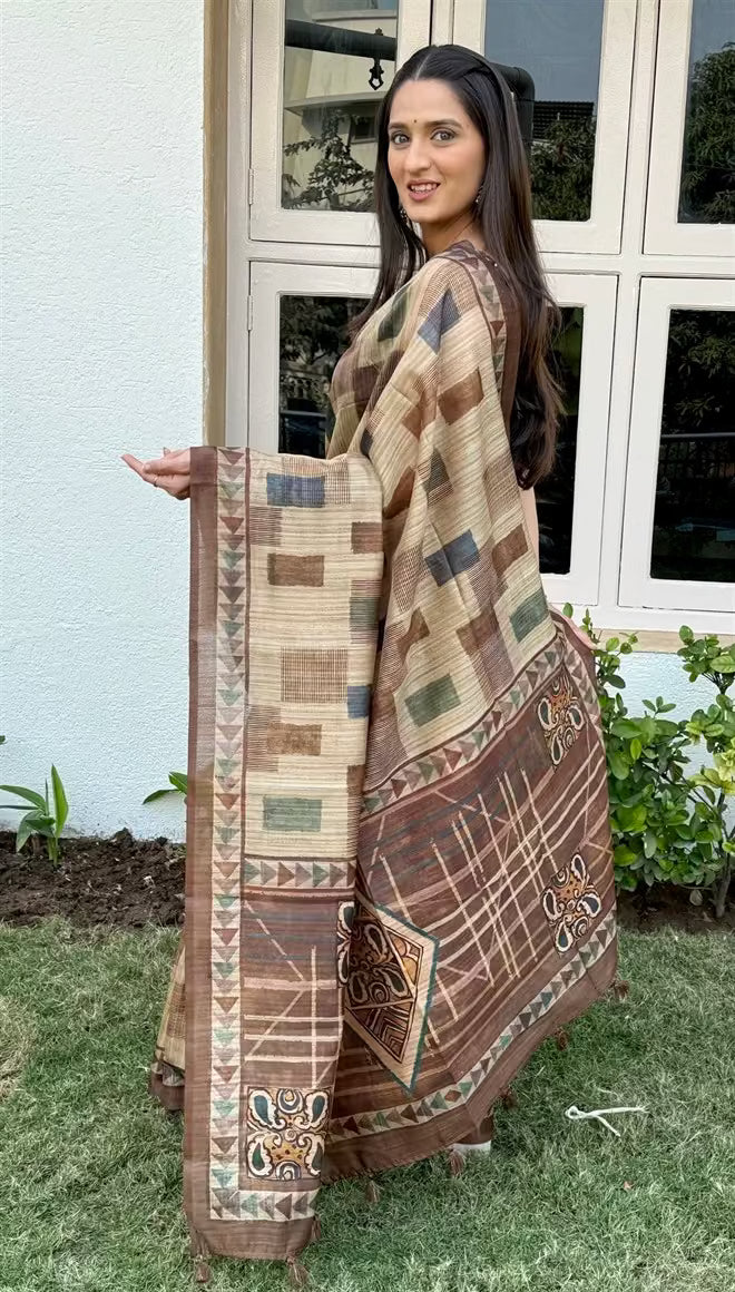Woman in Geometric Block Patchwork with Solid Brown border saree.