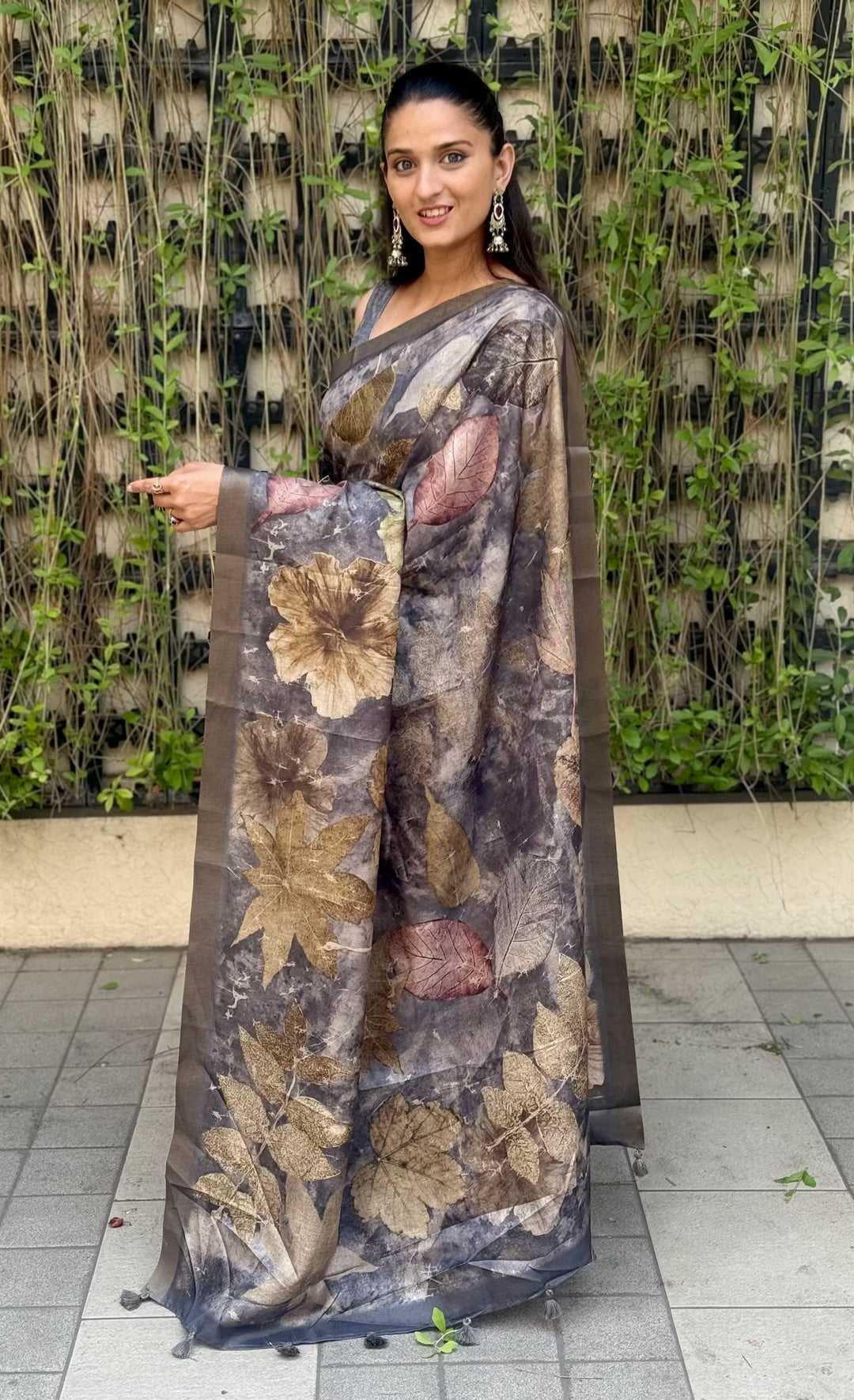 Woman wearing Grey Saree in Botanical Print with Zari Border.