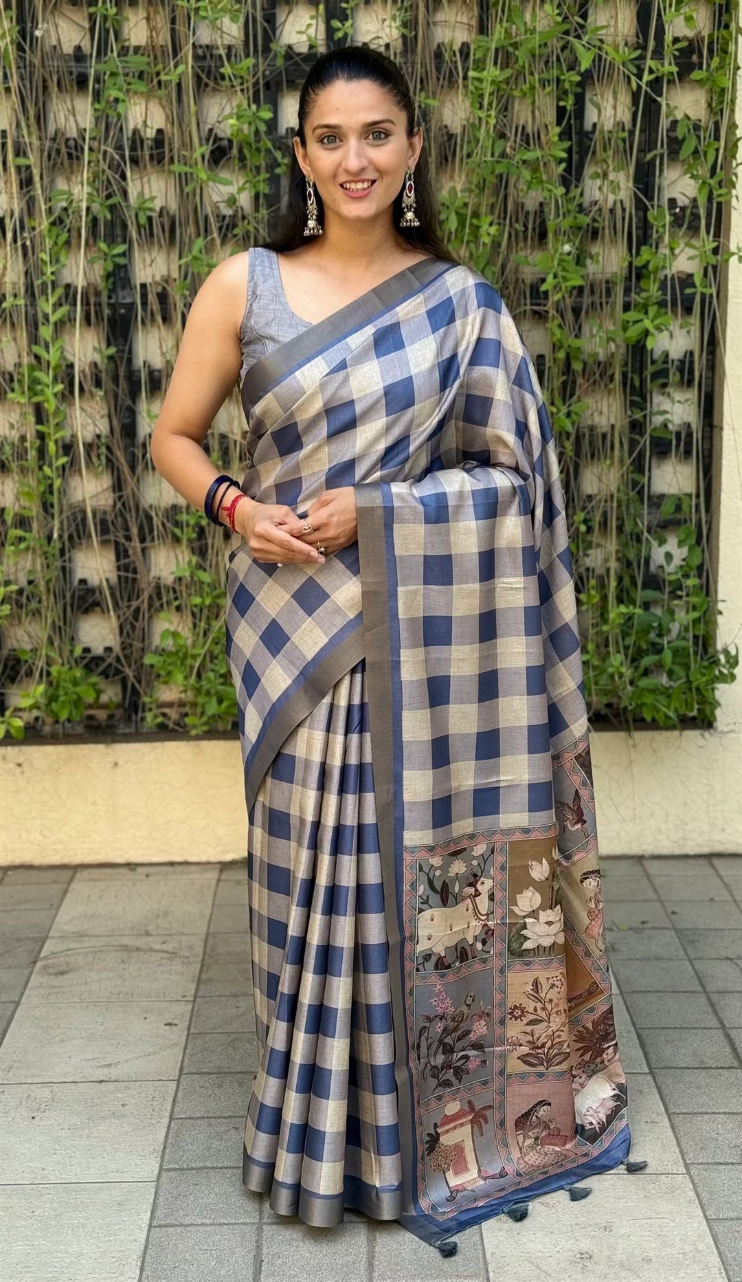 Woman wearing Steel Blue color saree in checks prints by Ethnic Today.