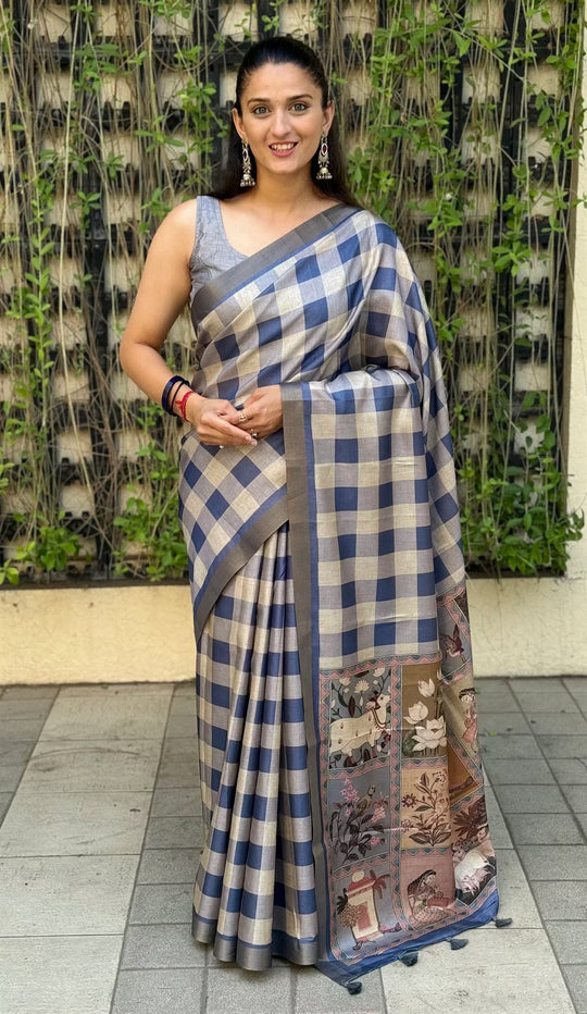 Woman wearing Steel Blue color saree in checks prints by Ethnic Today.