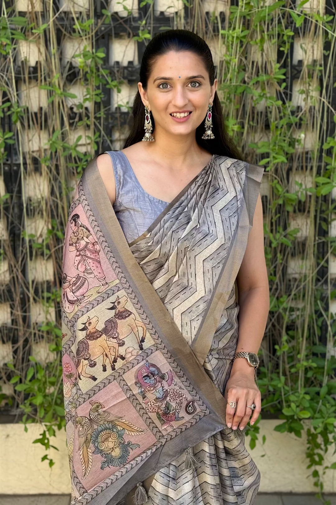Woman wearing Lehariya Metallic Grey with Zari Border Silk Saree.