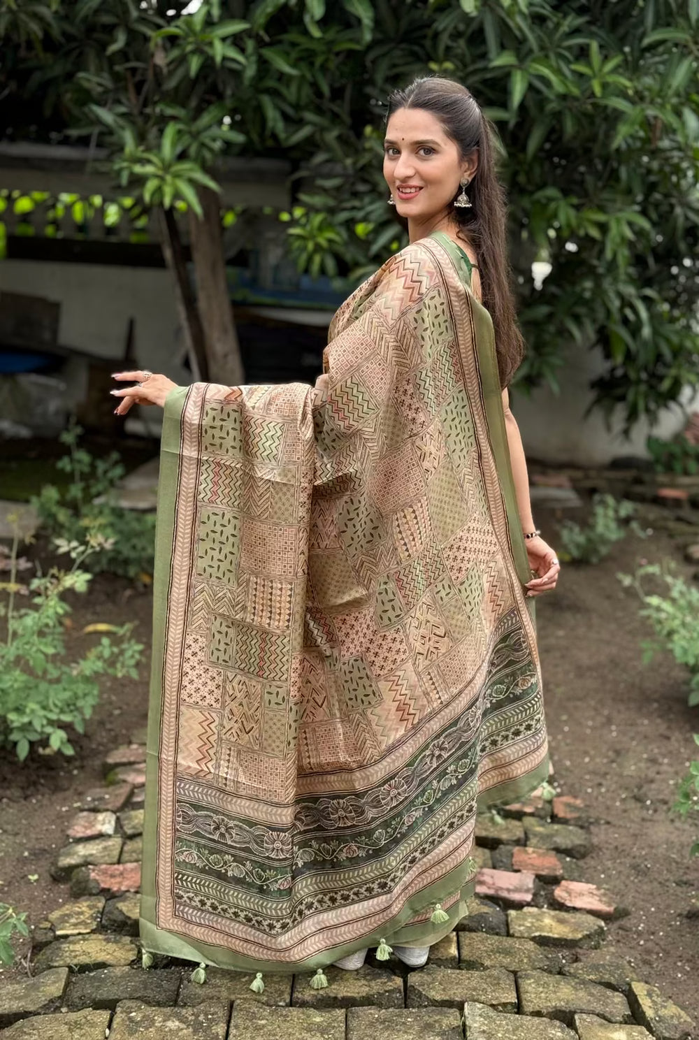 Woman wearing Geometric prints in Pista & Earthy Beige tones.