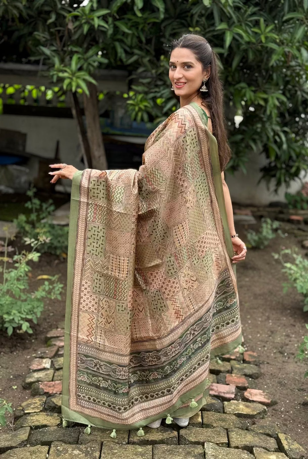 Woman wearing Geometric prints in Pista & Earthy Beige tones.