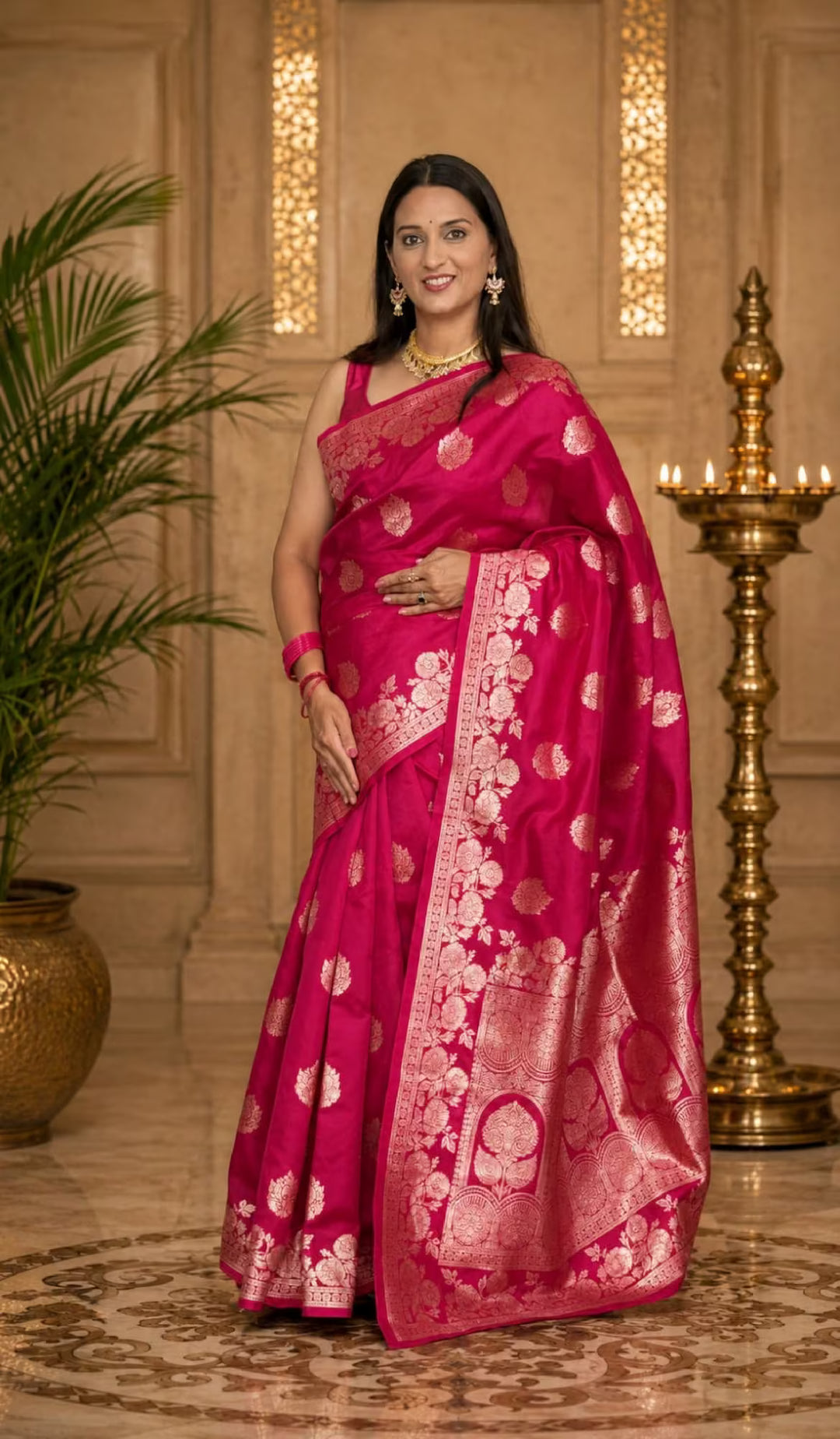 Woman in Rani Pink floral jacquard saree.