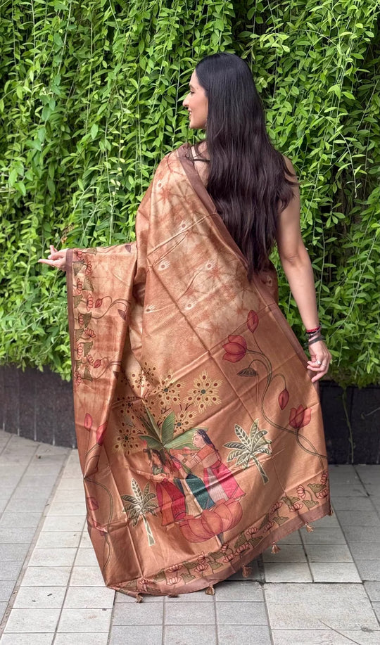 A women wearing copper color saree in kalamkari lotus print with brown border by Ethnic Today.