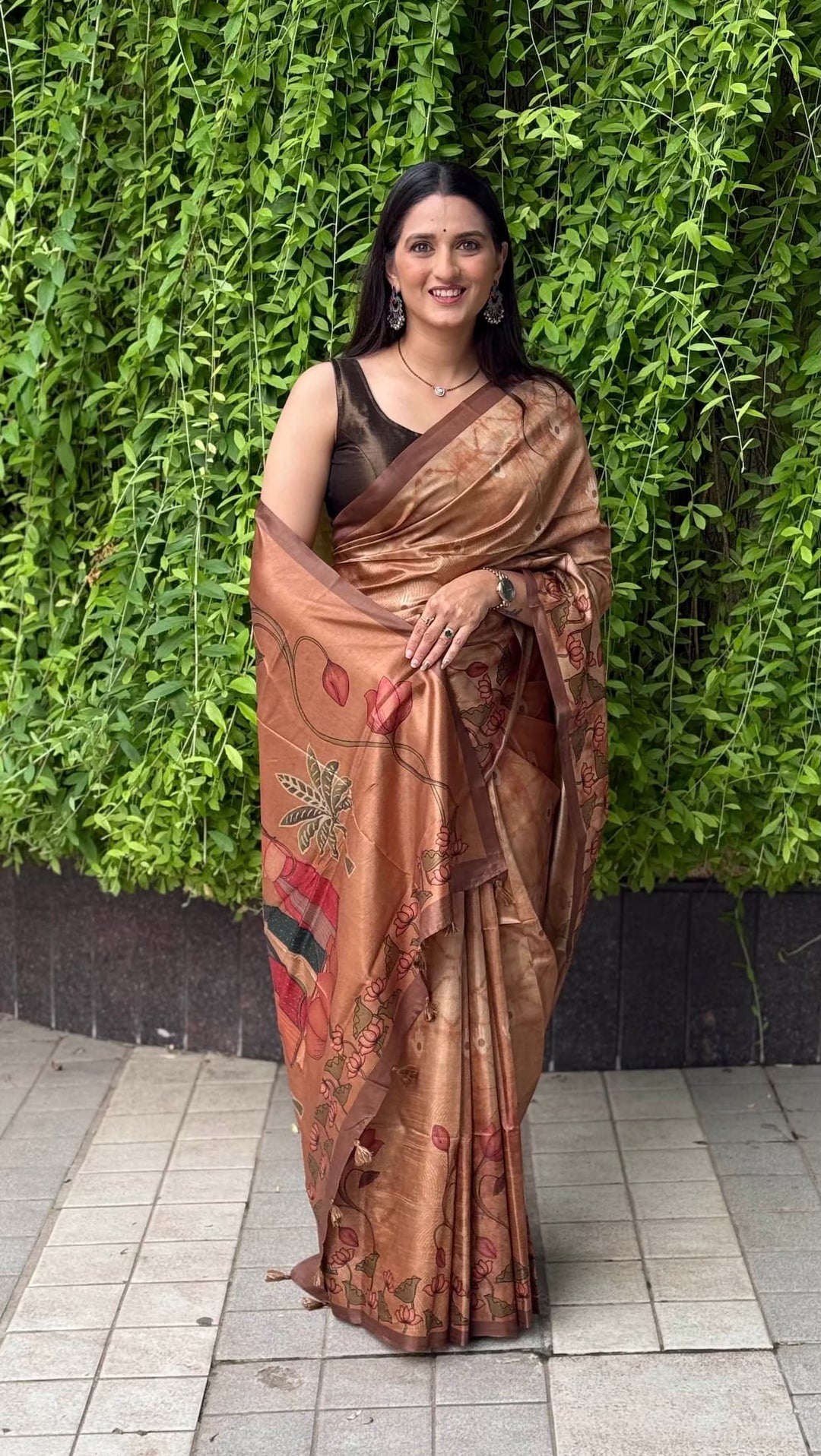 Women in copper colour with lotus motif tussar silk saree by Ethnic Today.
