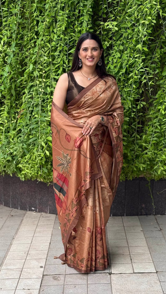 Women in copper colour with lotus motif tussar silk saree by Ethnic Today.