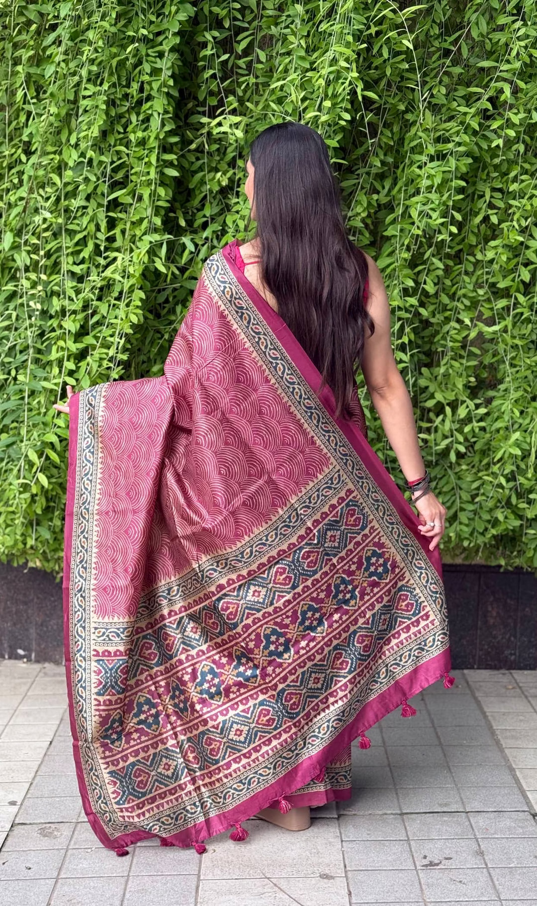 Woman wearing Rani color Wave printed saree by Ethnic Today.