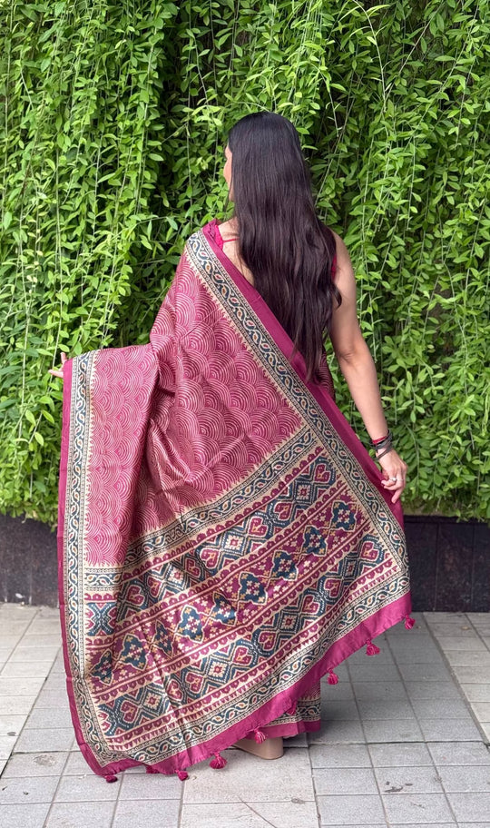 Woman wearing Rani color Wave printed saree by Ethnic Today.
