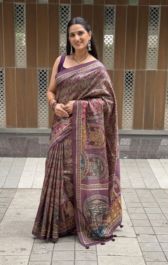 Woman wearing tribal printed pallu saree with abstract print all over saree.