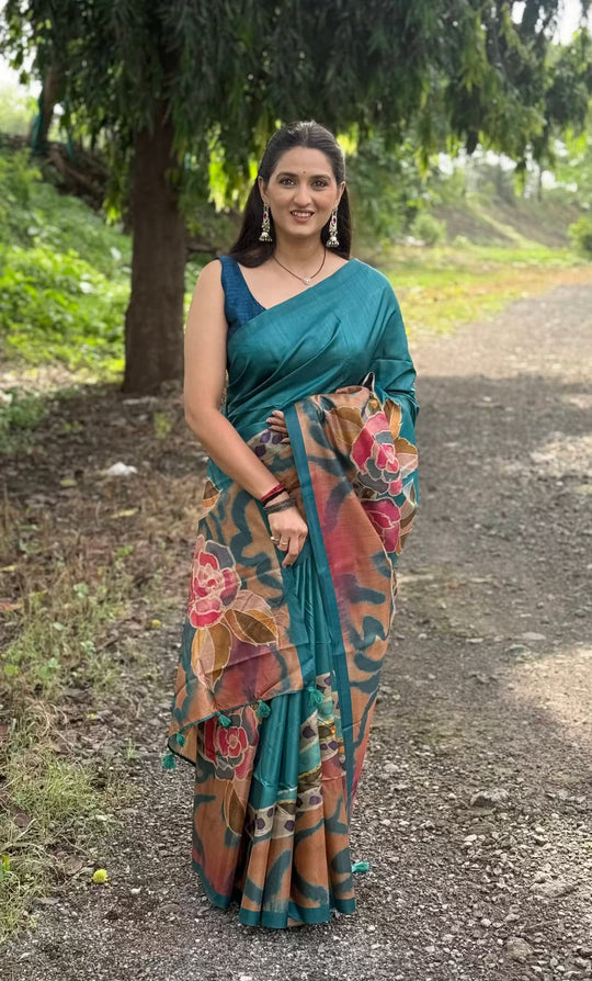 Woman wearing peacock blue saree by Ethnic Today perfect for party wear.