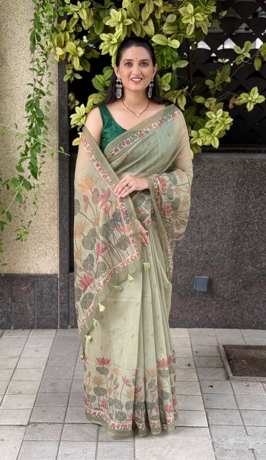 Woman wearing Lotus motif saree in mehndi green color by Ethnic Today. 
