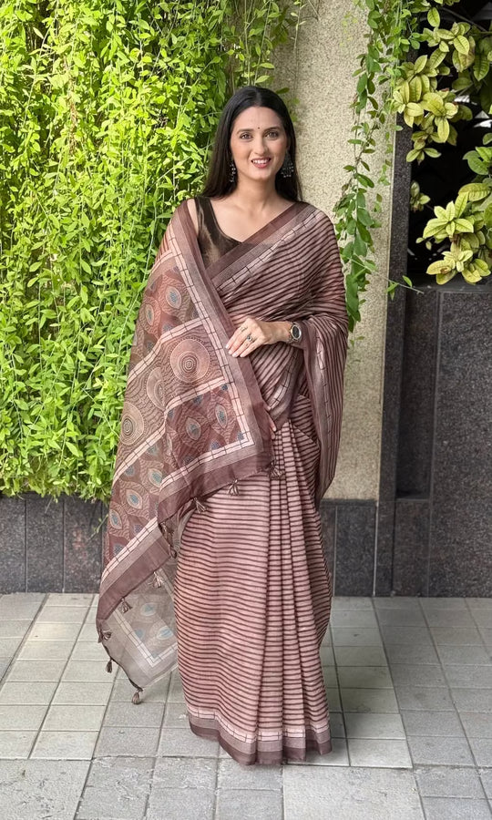 Woman in daily wear striped saree by ethnic today.