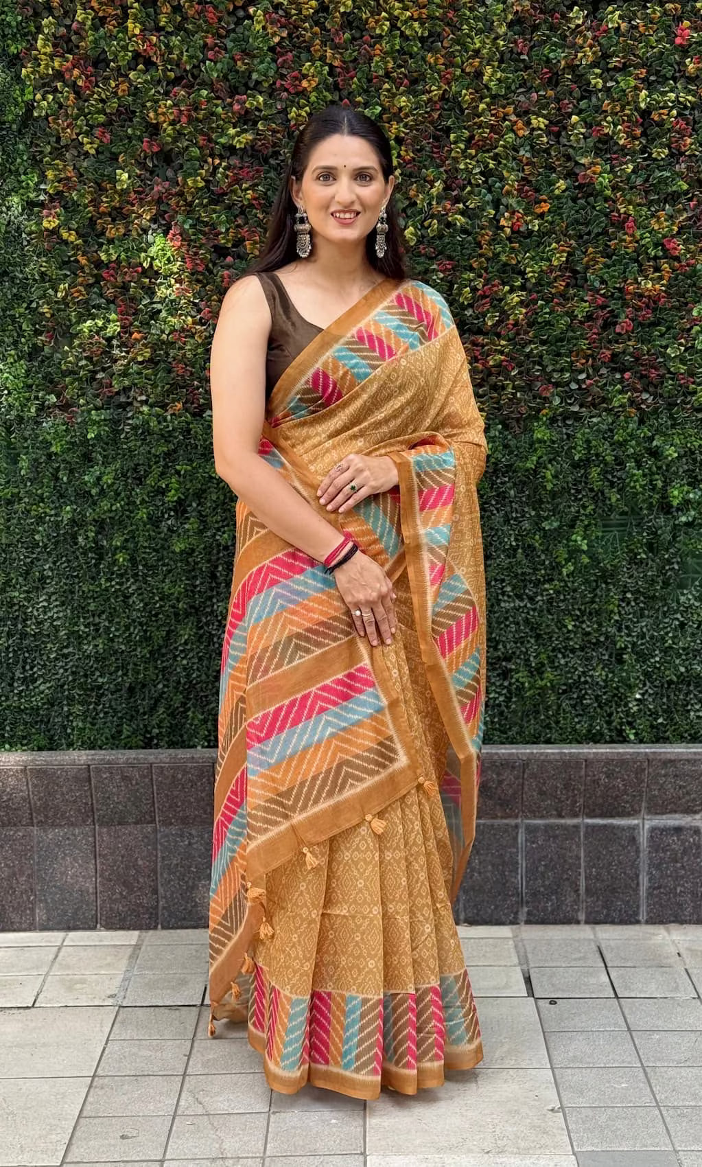 Woman wearing saree in multicolor chanderi silk saree perfect for haldi look.