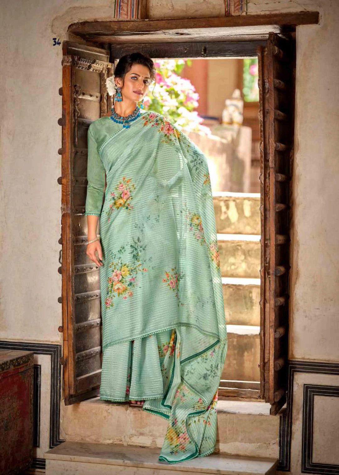 Pastel green floral Printed saree for woman by Ethnic today.