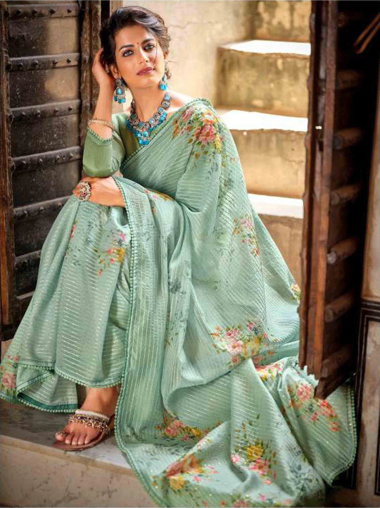 Woman in Pastel green floral Printed saree.