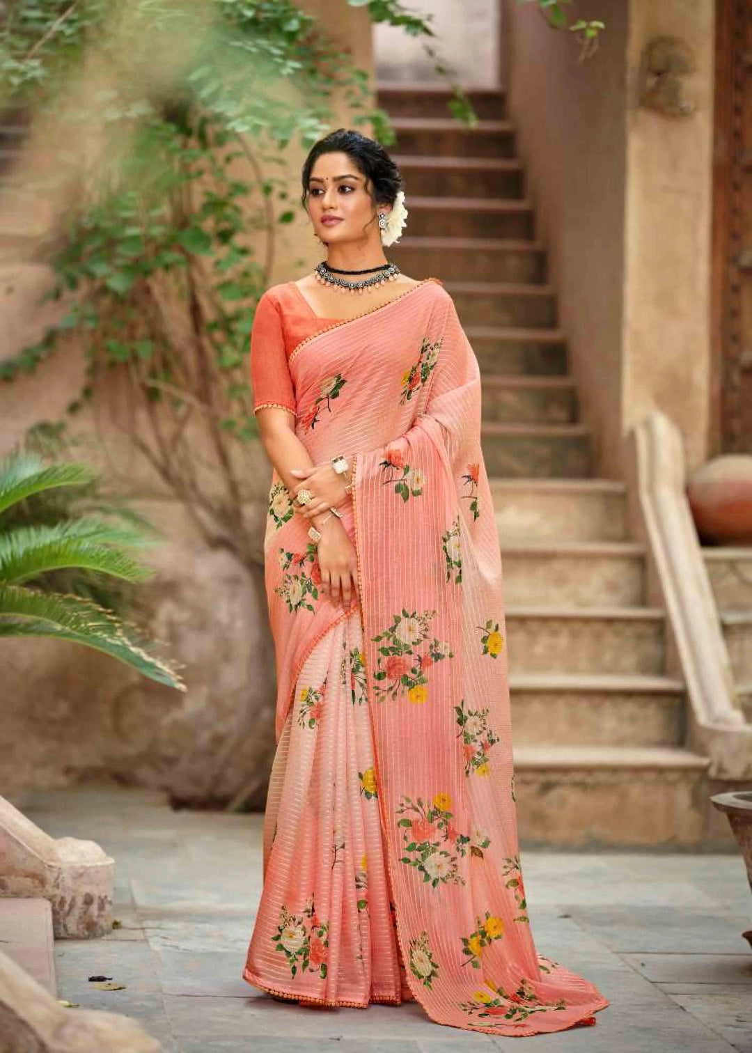 Woman in Light Orange Crochet work Saree.