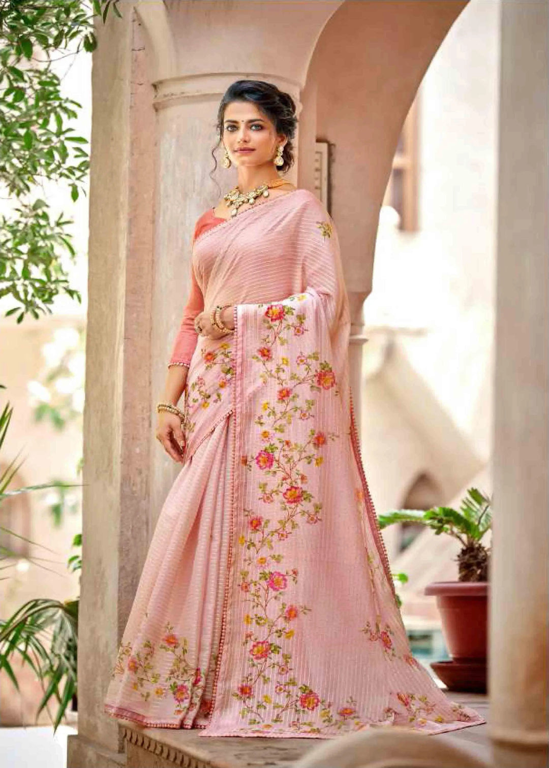 Woman in Light Pink Crochet work Floral printed saree.