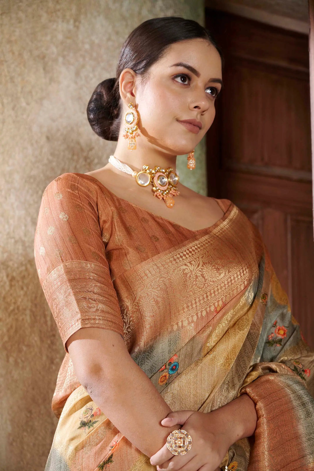 Woman in Orange Position printed saree for woman by Ethnic today.