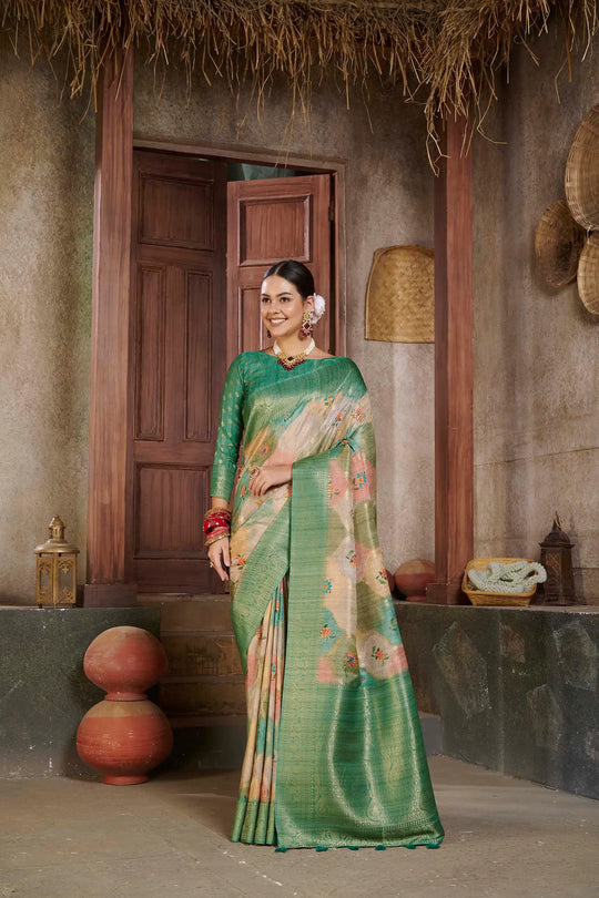Woman in a green Flower design Position printed saree.