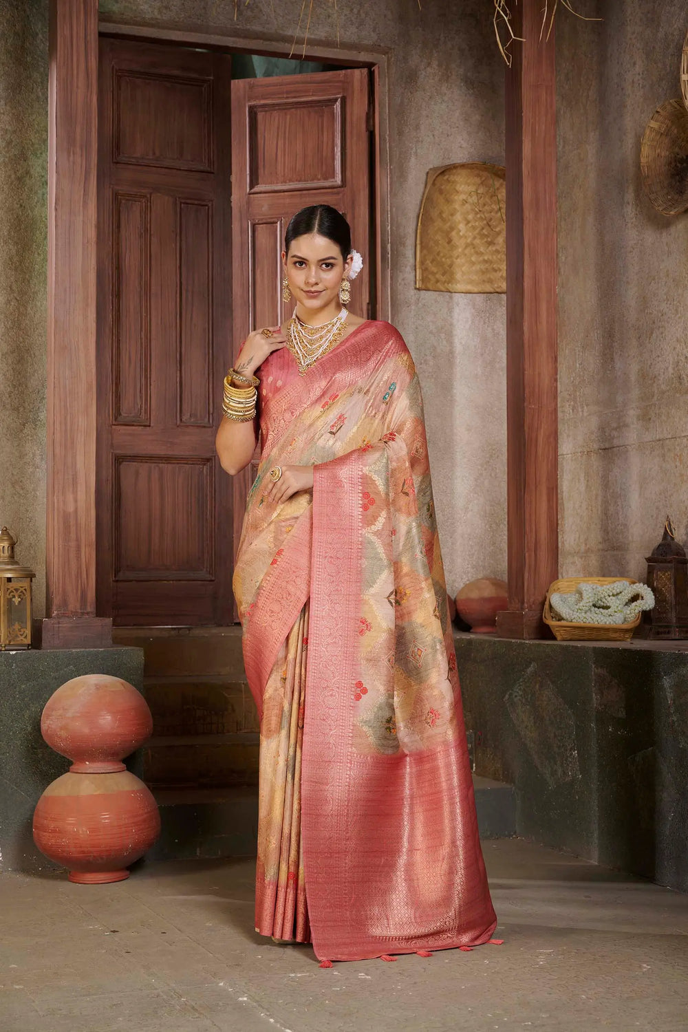 Woman in Pink color Position Printed saree.