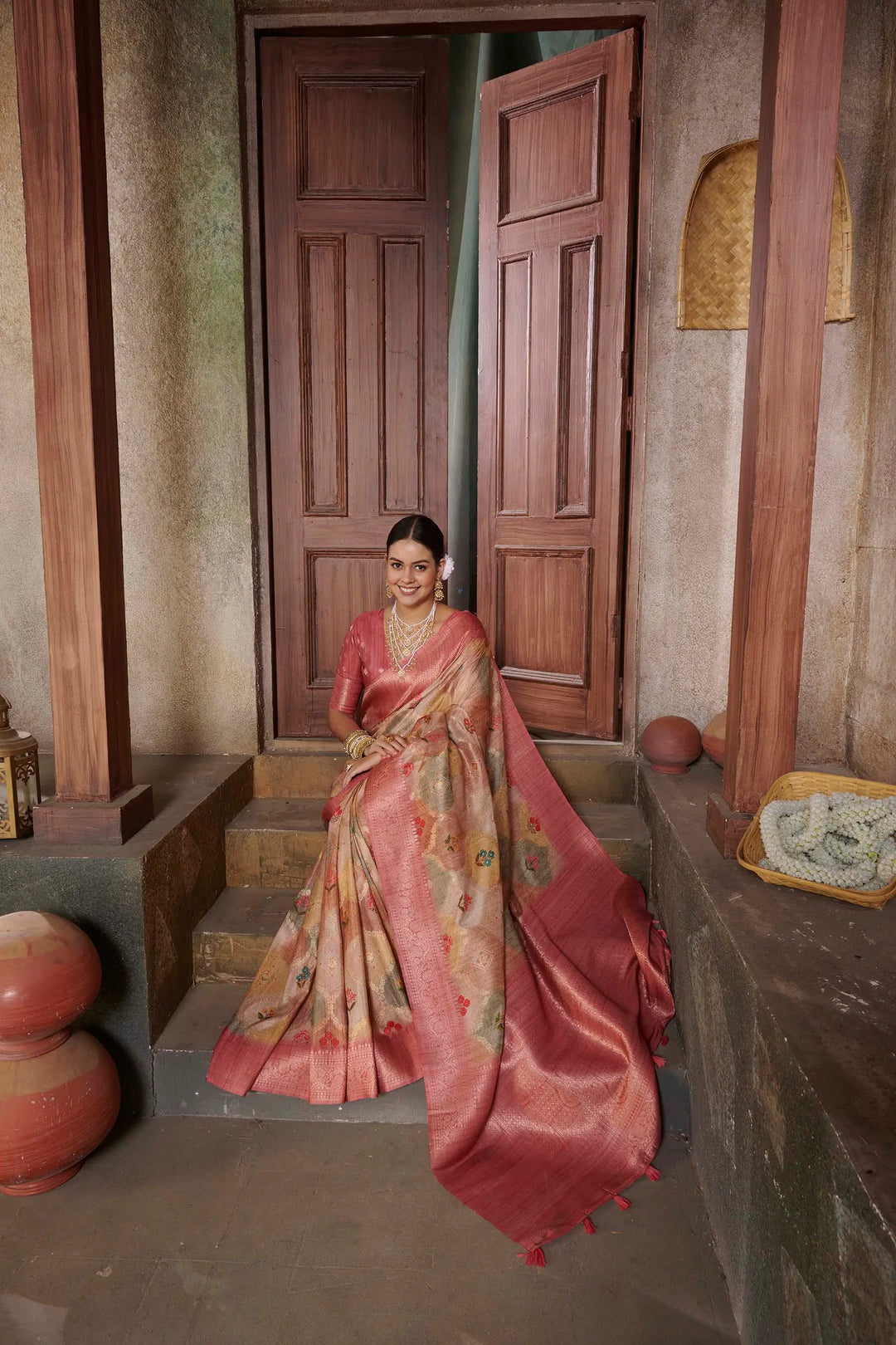 Woman in Pink color Position printed rich pallu saree.