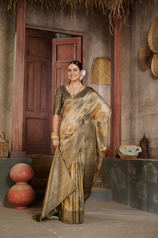 Woman in Coffee color Position print saree.