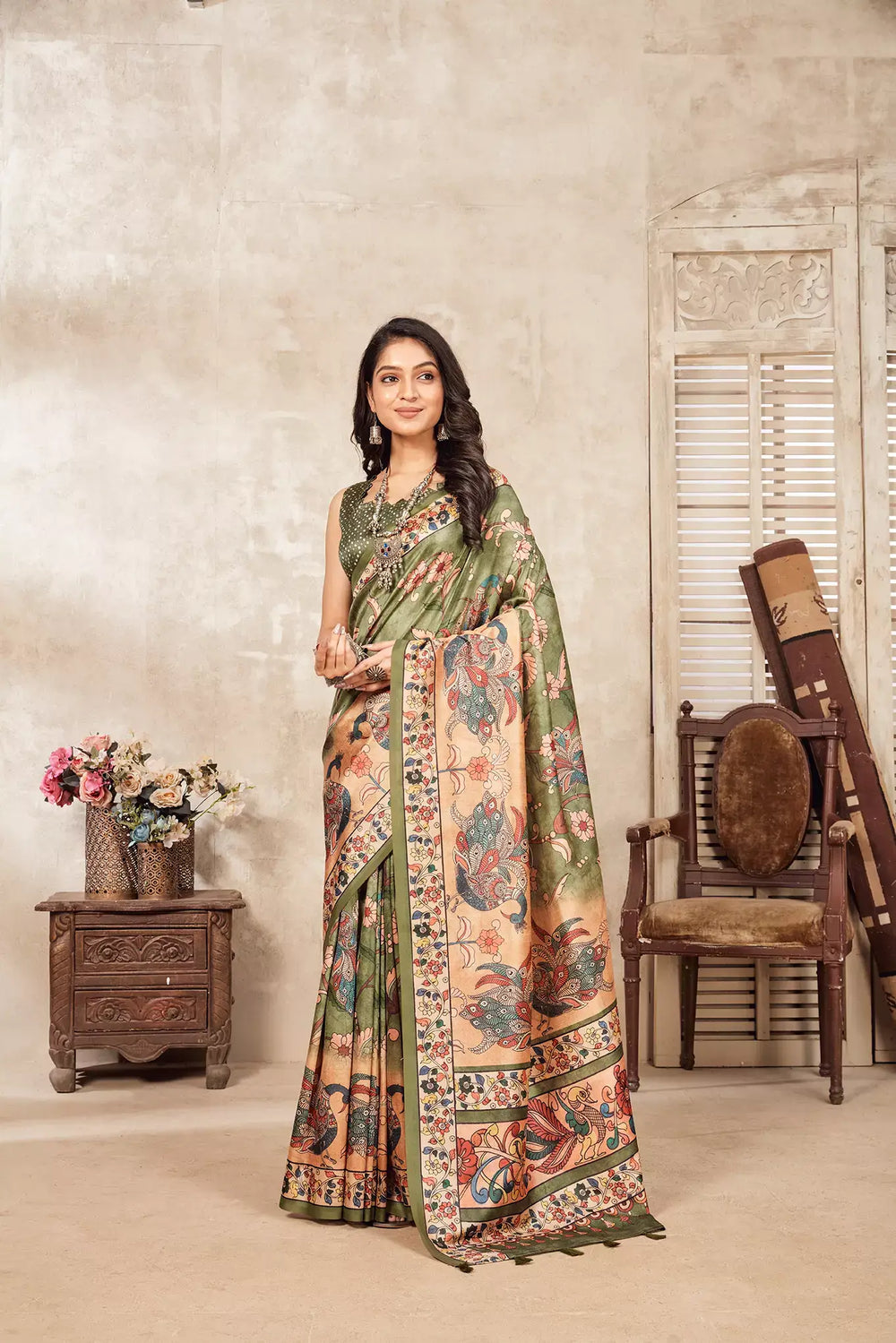 woman in Green colour Kalamkari peacock Dia silk Saree.