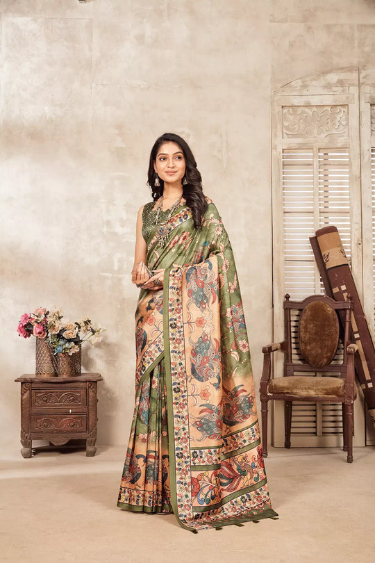 woman in Green colour Kalamkari peacock Dia silk Saree.